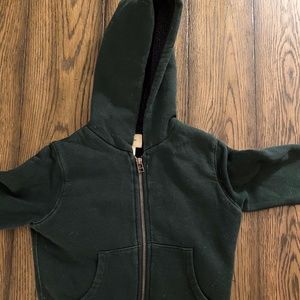 Green zip up jacket with orange stripe